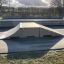 Bank - skateboarding ramp in an outdoor skatepark.