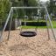 Silver Single Swing (BNS) in a playground on a sandy surface