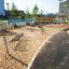 Playground with multiple Hammock structures on sandy ground.
