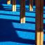 Wooden legs of playground equipment on a blue surface.