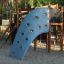 Mastodon castle with slide in a playground