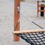 Hammock installed in a playground sandbox.