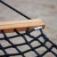 Close-up of Hammock with wooden bar and black rope netting