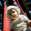 Toddler playing on Toddler Tower Slide in a playground.