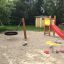 Playground with Toddler Tower Slide and sandbox toys.
