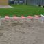 Outdoor playground equipment Wonderland Trim Trail with red steps.