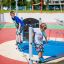 Children playing on the Wonderland Trim Trail playground equipment.