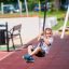 Child using Medium Cableway with platform at a playground.