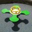 Green Clover rocking on playground surface
