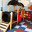 Locomotive with slide train playhouse in a colorful indoor playground