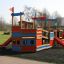 Colorful wooden Bounty ship with slide on a playground.