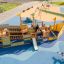 Children's playground in shape of pirate ship with slide.