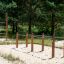 Double Gymnastic Bar in an outdoor forest playground.