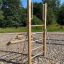 Vertical wooden ladder in outdoor playground setting