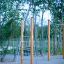 Vertical wooden ladder in an outdoor playground.