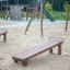 Wooden Gymnastic bench in a playground.