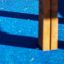 Horizontal ladder II wooden ladder on blue playground surface
