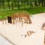 Children's playground equipment 'Jumping pegs' in a park setting.