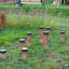 Wooden jumping pegs in a playground.