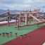 Jumping pegs' wooden playground equipment with climbing structure and stepping platforms on outdoor 
