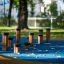 Jumping pegs outdoor playground equipment on a blue surface