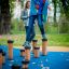Children playing on Jumping pegs in a park.