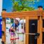 Child climbing on Climbing box wooden playhouse.