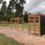 Outdoor Climbing Box Wooden Playhouse with Rope Ladders and Climbing Wall in Park.
