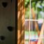 Climbing box wooden playhouse with climbing wall and rope ladder for children.
