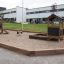 Oak Beam Section (running meter) framing a playground sandbox with wooden play structures.