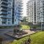 Oak Beam Section (running meter) installed in modern urban playground area with high-rise buildings 