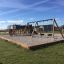 Outdoor playground with swings and climbing structure made from Oak Beam Section (running meter).