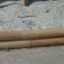 Triangle Sandbox with wooden edges and sandy play area