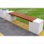 Vega Deco modern outdoor bench with wooden slats and white concrete sides on a paved walkway