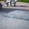 Concrete table tennis, free-standing table in a park setting.