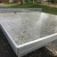 Concrete table tennis, free-standing in an outdoor park.