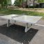 Free-standing concrete table tennis in a park.