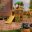 Wooden flowerpot I in a garden surrounded by a playground and blooming plants