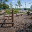 Outdoor wooden playground equipment Ramp with ropes and balance beams.