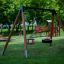 Swing Frame (double swing) in a park with a tire swing and a bucket seat swing.