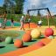 Children playing on Swing Frame (double swing) in a colorful playground.