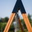 Wooden Swing Frame (double swing) with chains against a blue sky.