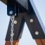 Swing Frame (single swing) close-up view of metal and wood components and chain attachment.