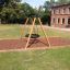 Swing Frame (single swing, wide) in a grassy playground area with woodchip base