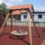 Single Swing Frame with wide seat in a playground.