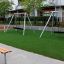 Swing Metal Frame in playground, single swing, wide base.
