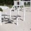 Outdoor playground equipment 'Kentucky Double' with wooden stepping platforms on a sandy area.