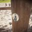 Close-up of the Kentucky Double outdoor playground equipment wooden post with metal element in a san