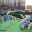 Playground equipment Windsor castle with slide with blue slides and towers on green mat in urban are