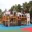 Windsor castle with slide playground structure with climbing features and towers.